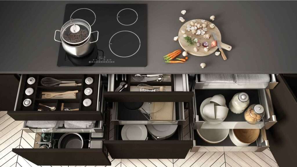 Open kitchen drawers that are organized.